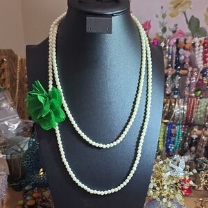 Elegant Pearl Necklace with Green Flower Accent